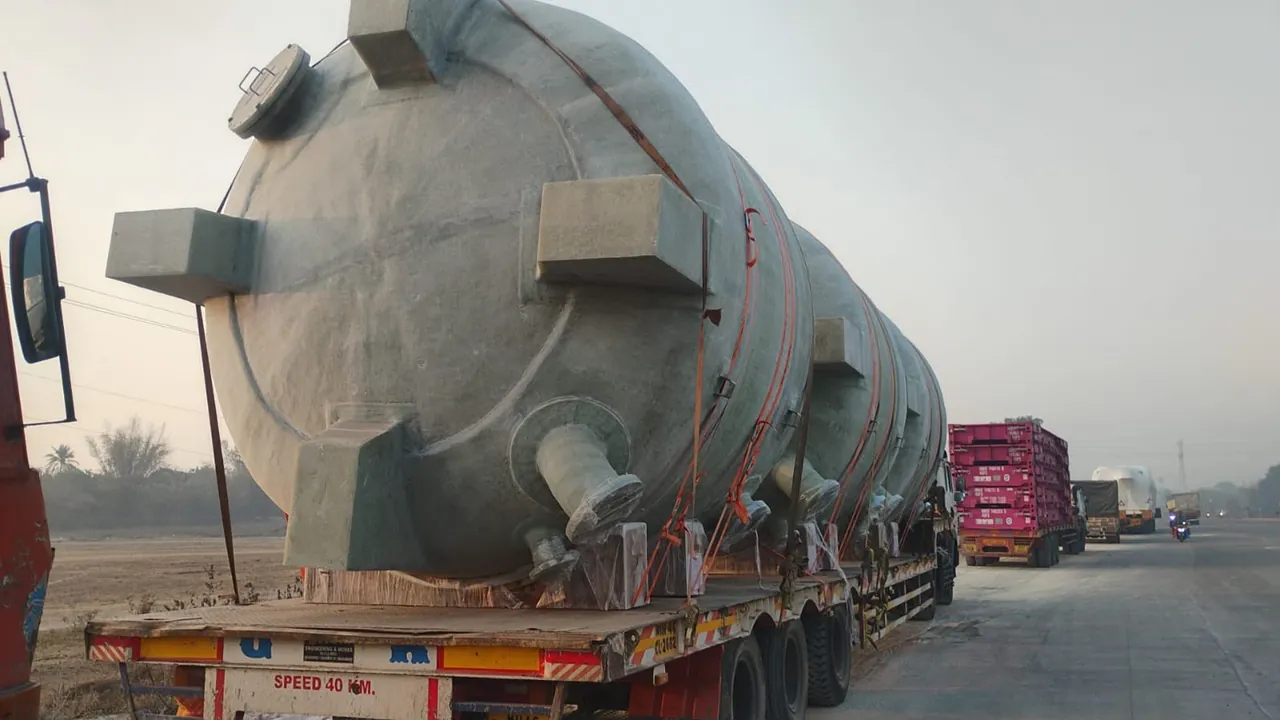 Large fibreglass tank transported on a low-bed trailer