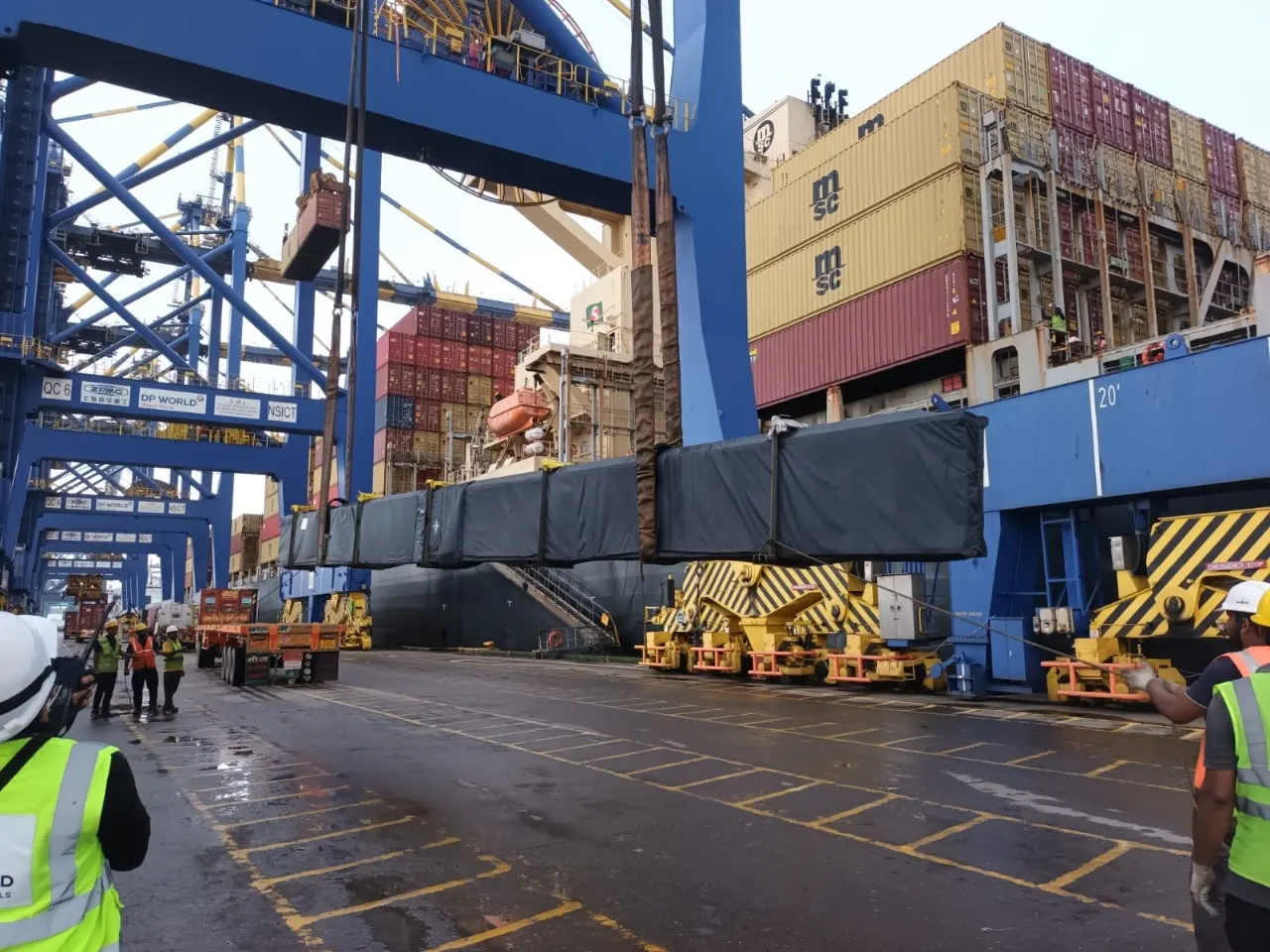 Cargo handling beside container vessel