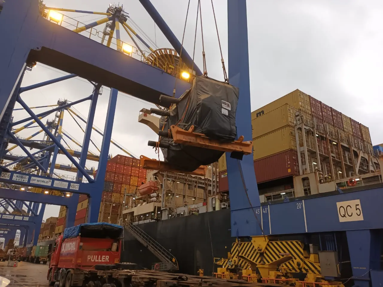 Port crane lifting cargo