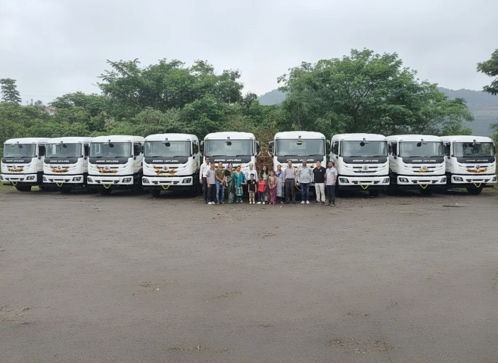 Fleet of trucks lined up with the ACHYUTAM team